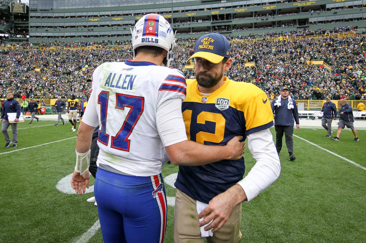 Josh Allen #17 of the Buffalo Bills and Aaron Rodgers #12 of the Green Bay Packers meet after the Green Bay Packers beat the Buffalo Bills 22-0 at Lambeau Field on September 30, 2018 in Green Bay, Wisconsin.
