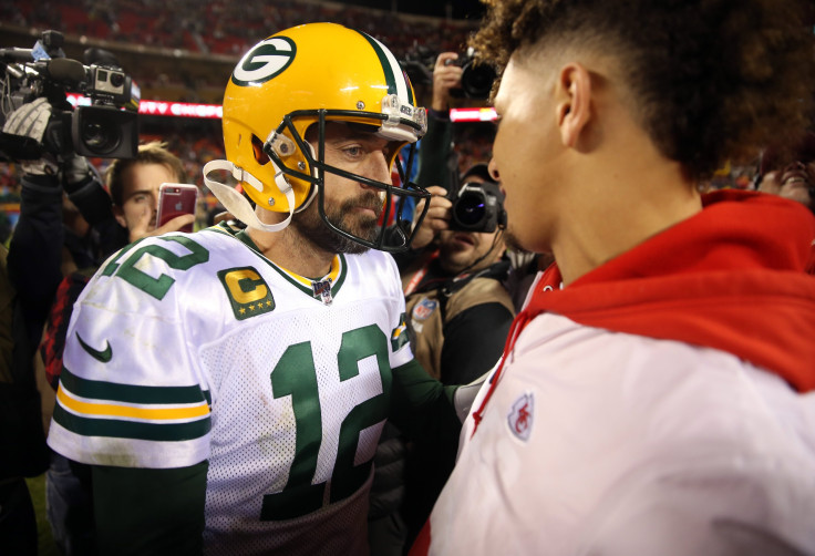 Quarterback Aaron Rodgers #12 of the Green Bay Packers greets quarterback Patrick Mahomes #15 of the Kansas City Chiefs at midfield after the Packers defeated the Chiefs 31-24 to win the game at Arrowhead Stadium on October 27, 2019 in Kansas City, Missou