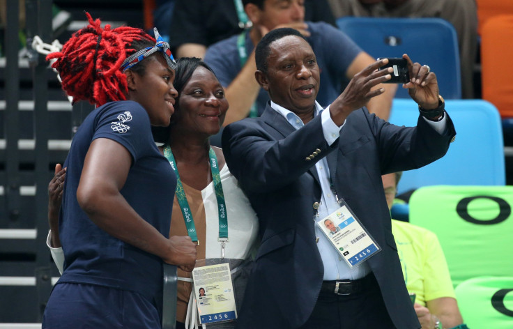 Hamane Niang takes a picture with Isabelle Yacoubou of France on day 13 of the Rio 2016 Olympic Games at Arena Carioca 2 