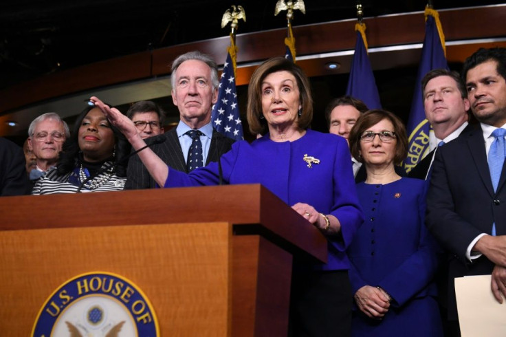 Speaker Nancy Pelosi and House Ways and Means Chairman Richard Neal (L) announce an agreement on a modified trade pact
