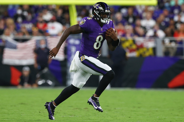 Lamar Jackson #8 of the Baltimore Ravens scrambles with the ball against the Kansas City Chiefs during the second quarter at M&T Bank Stadium on September 19, 2021 in Baltimore, Maryland. 