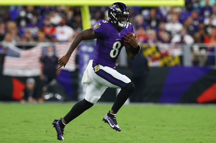 Lamar Jackson #8 of the Baltimore Ravens scrambles with the ball against the Kansas City Chiefs during the second quarter at M&T Bank Stadium on September 19, 2021 in Baltimore, Maryland.
