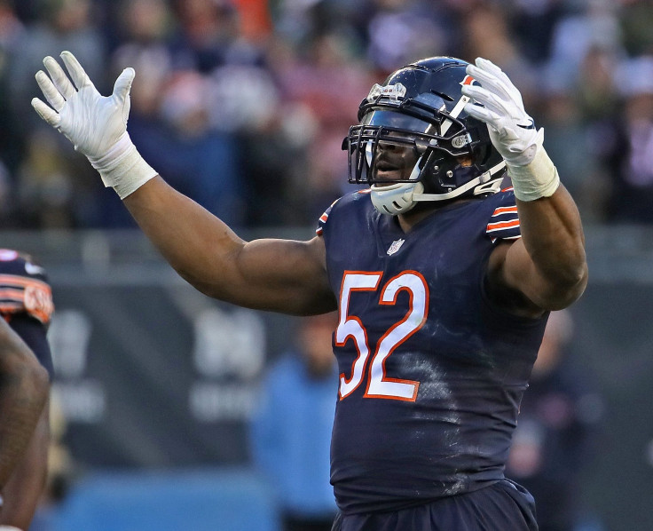 Khalil Mack #52 of the Chicago Bears encourages the crowd to cheer during a game against the Green Bay Packers at Soldier Field on December 16, 2018 in Chicago, Illinois.