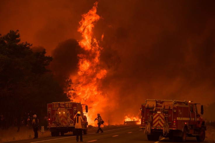 Thousands of firefighters are battling blazes throughout California as voters go to the polls to decide on whether or not to recall Governor Gavin Newsom