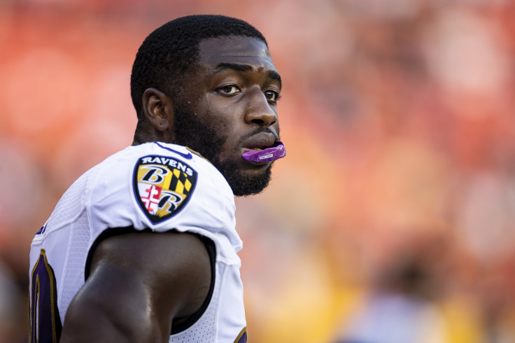 Odafe Oweh #99 of the Baltimore Ravens looks on during the game against the Washington Football Team during the first half of the preseason game at FedExField on August 28, 2021 in Landover, Maryland.