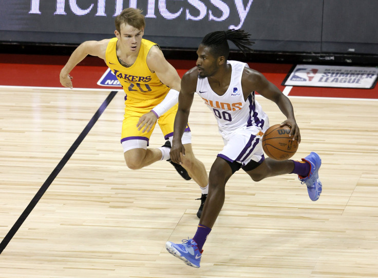 Jaleen Smith #00 of the Phoenix Suns brings the ball up the court against Mac McClung #20 of the Los Angeles Lakers