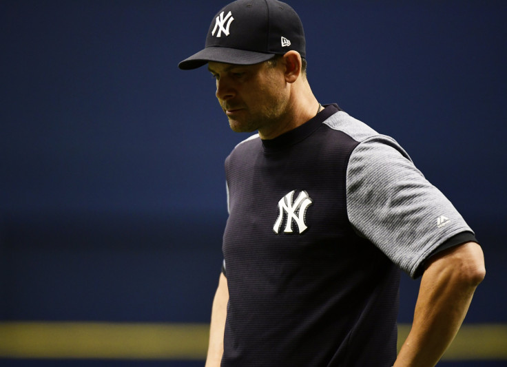 Aaron Boone #17 of the New York Yankees reacts after CC Sabathia #52 hit Jesus Sucre #45 of the Tampa Bay Rays by a pitch in the sixth inning on September 27, 2018 at Tropicana Field in St Petersburg, Florida.