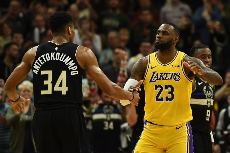 Giannis Antetokounmpo #34 of the Milwaukee Bucks and LeBron James #23 of the Los Angeles Lakers hug following a game at Fiserv Forum on December 19, 2019 in Milwaukee, Wisconsin. 