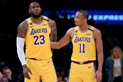 LeBron James #23 of the Los Angeles Lakers reacts to Avery Bradley #11