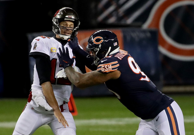 Roy Robertson-Harris #95 of the Chicago Bears hits Tom Brady #12 of the Tampa Bay Buccaneers in the third quarter at Soldier Field on October 08, 2020 in Chicago, Illinois.