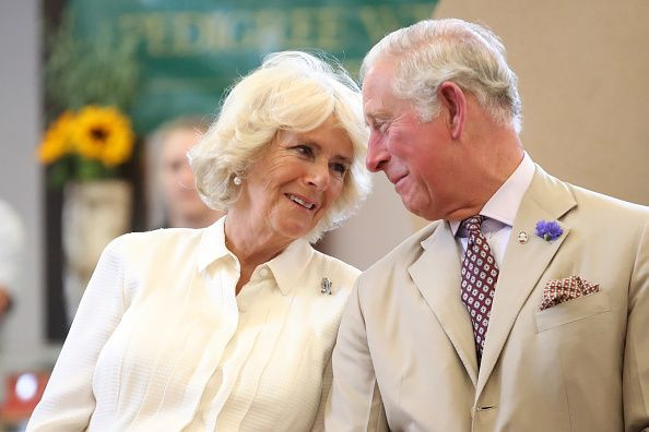 Camilla Parker Bowles and Prince Charles look at each other as they reopen the newly-renovated Edwardian community hall The Strand Hall during day three of a visit to Wales on July 4, 2018 in Builth Wells, Wales.