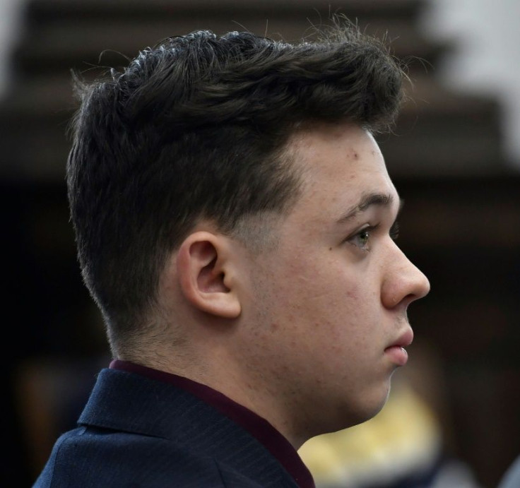 Kyle Rittenhouse listens as Assistant District Attorney Thomas Binger gives an opening statement to the jury during his trial at the Kenosha County Courthouse in Kenosha, Wisconsin.