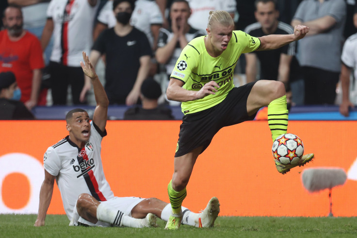 Welinton of Besiktas reacts as Erling Haaland of Borussia Dortmund controls the ball during the UEFA Champions League group C match between Besiktas and Borussia Dortmund at Vodafone Park on September 15, 2021 in Istanbul, Turkey.