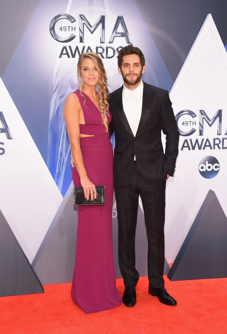 Lauren Gregory (left) and Thomas Rhett (right) stay close by each others sides on the 2015 CMA Awards red carpet at Nashville, Tennessee's own Bridgestone Arena.