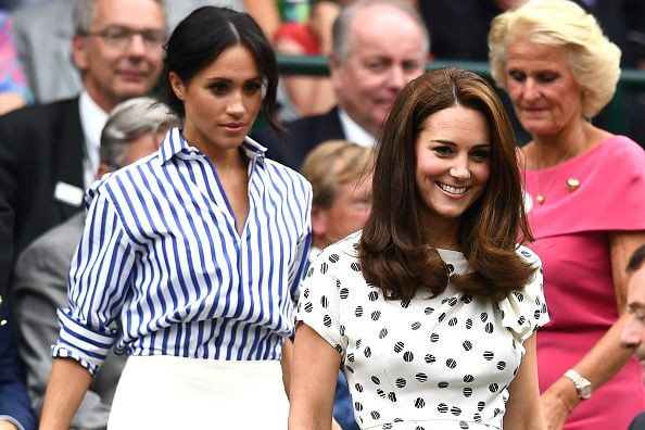 Kate Middleton and Meghan Markle attend day twelve of the Wimbledon Lawn Tennis Championships at All England Lawn Tennis and Croquet Club on July 14, 2018, in London.
