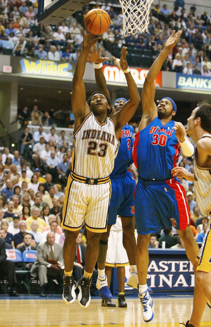  Ron Artest #23 of the Indiana Pacers goes to the basket past Ben Wallace #3 and Rasheed Wallace #30 of the Detroit Pistons in Game one of the Eastern Conference Finals during the 2004 NBA Playoffs at Conseco Fieldhouse on May 22, 2004 in Indianapolis, In