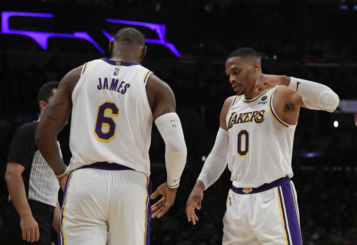 Russell Westbrook #0 of the Los Angeles Lakers congratulates LeBron James #6 after scoring he scored a basket and was fouled against the Detroit Pistons