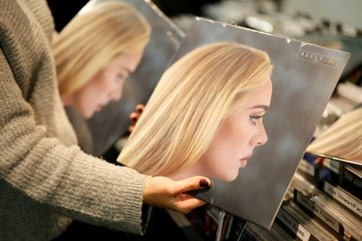 A worker sorts copies of Adele's new album "30" in the Sister Ray record store in central London on November 19, 2021