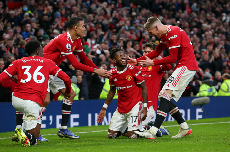 DECEMBER 05: Fred of Manchester United celebrates with teammates after scoring their side's first goal during the Premier League match between Manchester United and Crystal Palace at Old Trafford on December 05, 2021 in Manchester, England.