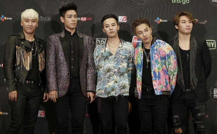 Members of South Korean K-Pop band BIGBANG pose backstage after winning Artist of the Year award in 2015 Mnet Asian Music Awards (MAMA) in Hong Kong, Dec. 3, 2015.