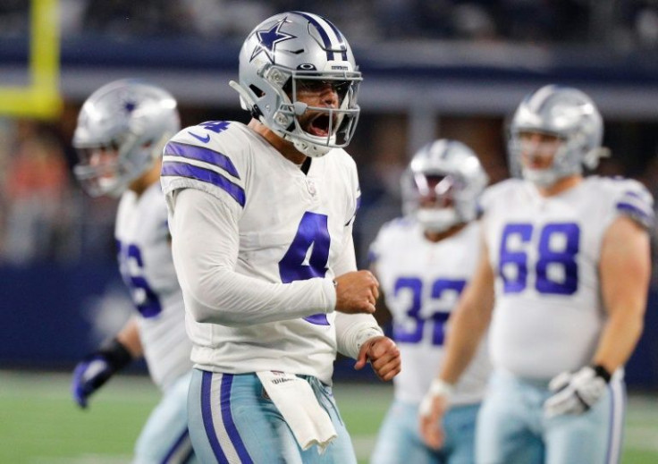 Dallas quarterback Dak Prescott reacts after a touchdown in the second quarter of the Cowboys' 56-14 NFL victory over the Washington Football Team