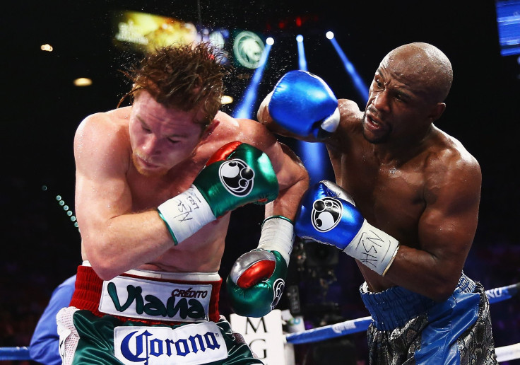 Canelo Alvarez claimed Floyd Mayweather would not risk a rematch with him. In this picture, Mayweather throws a right to Alvarez during their WBC/WBA 154-pound title fight at the MGM Grand Garden Arena in Las Vegas, Sept. 14, 2013.