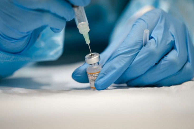 A nurse prepares the Pfizer-BioNTech Covid-19 vaccine for children for distribution in Montreal, Quebec on November 24, 2021