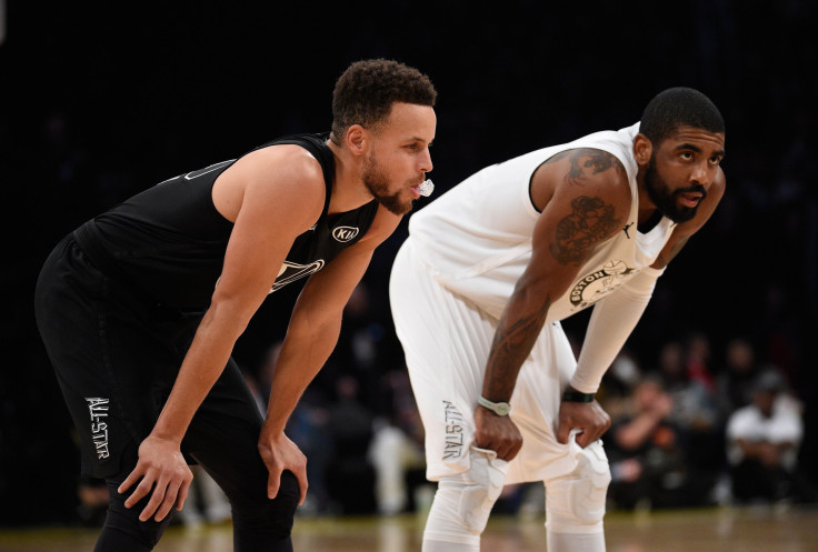 Stephen Curry and Kyrie Irving are both dealing with injuries ahead of the playoffs. Pictured: Curry and Irving take a breather during the NBA All-Star Game 2018 at Staples Center on Feb. 18, 2018 in Los Angeles.