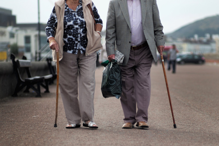 Senior citizens walk along Llandudno Promenade in Llandudno, Wales, United Kingdom, Sept. 8, 2014. 