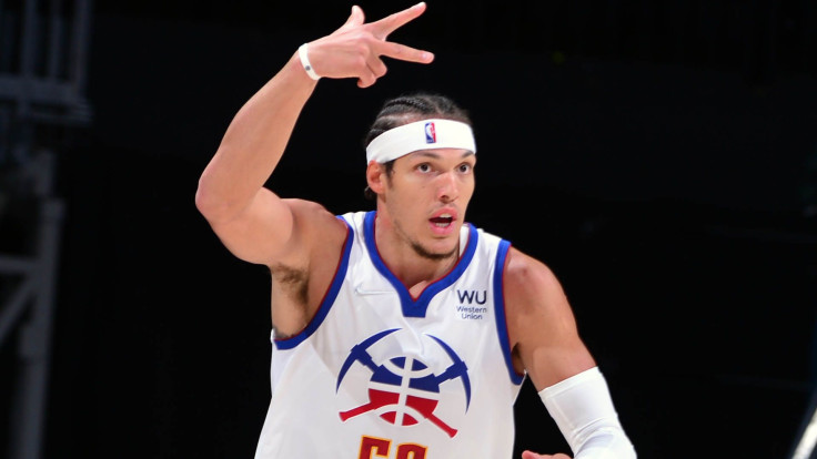 Aaron Gordon of the Denver Nuggets signals a play as he ran across the court.