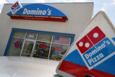 Domino's Pizza said a delivery driver has been fired after surveillance footage at a building in Surrey, England caught the man on video eating pizza toppings while in an elevator, Jan.23, 2018. In this photo, a Domino's Pizza store in Miami, Florida, Apr