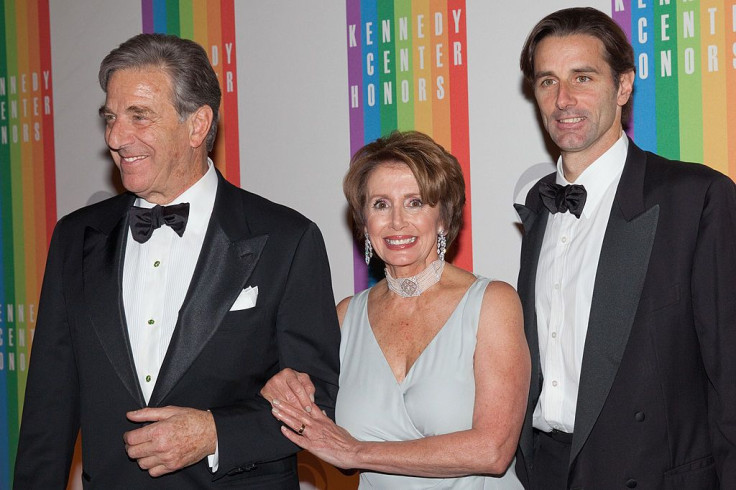 House Minority Leader Nancy Pelosi (C) arrives with her husband Paul Pelosi (L) and son Paul Pelosi, Jr. at the 35th Kennedy Center Honors
