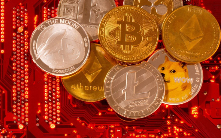 Representations of cryptocurrencies Bitcoin, Ethereum, DogeCoin, Ripple, Litecoin are placed on PC motherboard in this illustration taken, June 29, 2021.