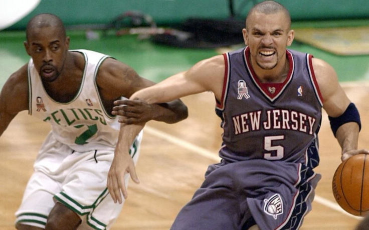 Kenny Anderson of the Boston Celtics chases Jason Kidd of the New Jersey Nets.