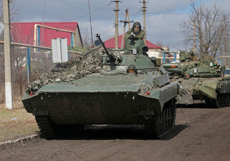 Service members of pro-Russian troops in uniforms without insignia drive an armoured vehicle in the separatist-controlled village of Bugas during Ukraine-Russia conflict in the Donetsk region, Ukraine March 6, 2022.