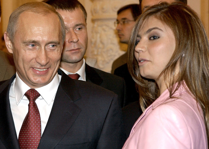 Russian President Vladimir pictured with his alleged girlfriend, former gymnast Alina Kabaeva, at a Russian Olympic team meeting in Moscow, November 4, 2004.