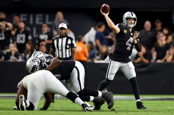 Las Vegas quarterback Derek Carr tosses a pass against the Baltimore Ravens in the season opener for both teams at Allegiant Stadium in Las Vegas, Nevada