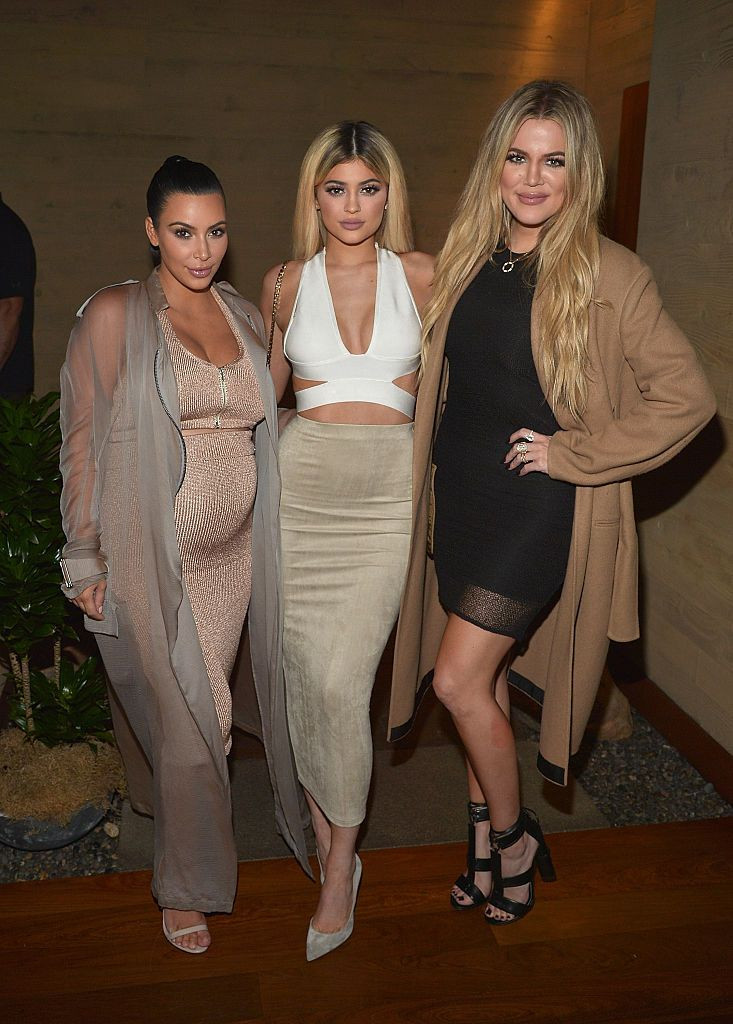 Kim Kardashian West (L), Kylie Jenner (M), and Khloe Kardashian (R) are planning to let their daughters have a photoshoot. In this photo, the sisters host a dinner and preview of their new apps at Nobu Malibu on Sept. 1, 2015 in Malibu, California.