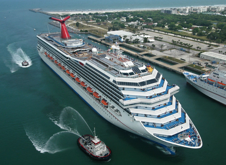 In this photo, escorted by water-squirting tugs, the new Carnival Glory arrives in Cape Canaveral, Florida, on July 11, 2003. 