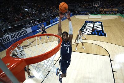 KC Ndefo #11 of the St. Peter's Peacocks dunks against the Murray State Racers in the second half during the second round of the 2022 NCAA Men's Basketball Tournament at Gainbridge Fieldhouse on March 19, 2022 in Indianapolis, Indiana.