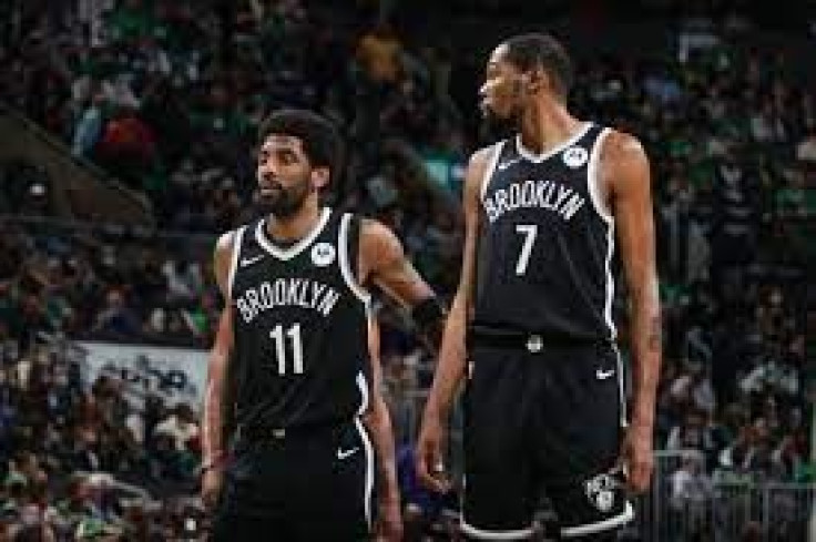 Kyrie Irving (L) and Kevin Durant (R) of the Brooklyn Nets during a game against the Boston Celtics in the 2021 NBA Playoffs on May 30, 2021.