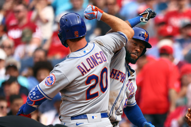 Pete Alonso #20 of the New York Mets is congratulated by Starling Marte #6 after he hit a three-run home run against the Philadelphia Phillies during the sixth inning of a game at Citizens Bank Park on April 13, 2022 in Philadelphia, Pennsylvania.