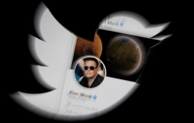 Elon Musk is the new owner of Twitter as he struck a deal Monday to purchase the social media platform that he says will champion free speech. Musk's twitter account is seen through the Twitter logo in this illustration taken, April 25, 2022. 