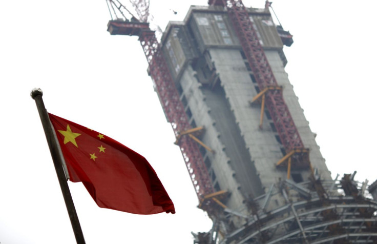 A Chinese national flag is seen near a construction site in Shanghai's financial district June 1, 2012. 