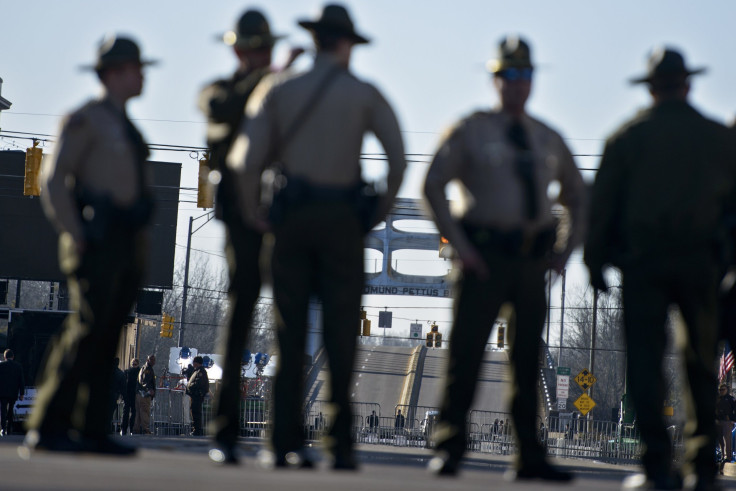In this photo, dated March 7, 2015, police officers block Broad Street near the Edmund Pettus Bridge in Selma, Alabama.