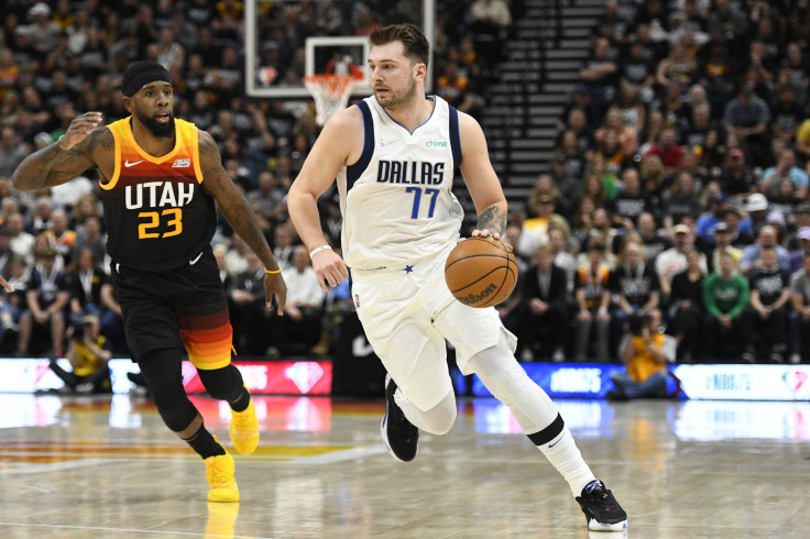 Luka Doncic #77 of the Dallas Mavericks drives past Royce O'Neale #23 of the Utah Jazz during the first half of Game 6 of the Western Conference First Round Playoffs at Vivint Smart Home Arena on April 28, 2022 in Salt Lake City, Utah.