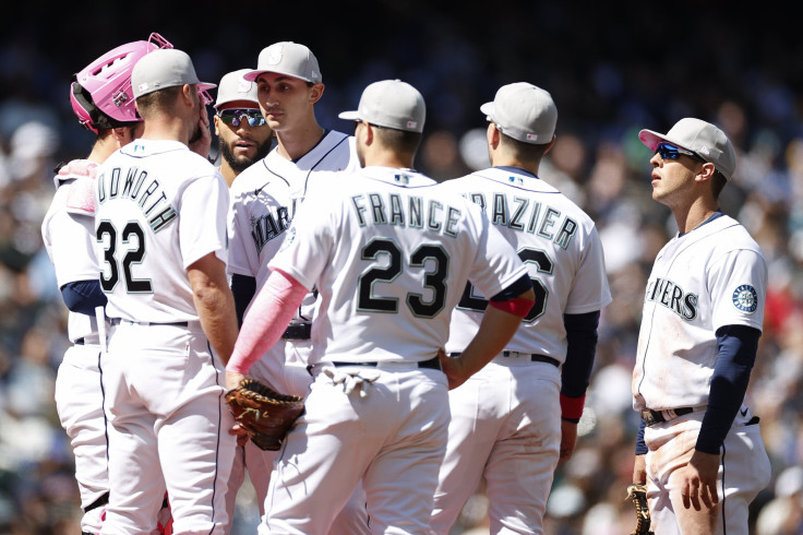 Pitching coach Pete Woodworth #32 talks with George Kirby #68 of the Seattle Mariners during Kirby's MLB debut against the Tampa Bay Rays at T-Mobile Park on May 08, 2022 in Seattle, Washington. 