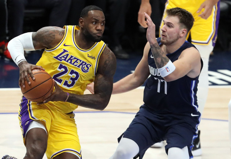 LeBron James #23 of the Los Angeles Lakers dribbles the ball against Luka Doncic #77 of the Dallas Mavericks in the first quarter at American Airlines Center on Nov. 1, 2019 in Dallas.