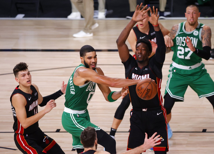 Jayson Tatum #0 of the Boston Celtics looks to pass against Tyler Herro #14 of the Miami Heat during the fourth quarter in Game Four of the Eastern Conference Finals during the 2020 NBA Playoffs at AdventHealth Arena at the ESPN Wide World Of Sports Compl
