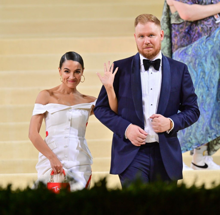 Alexandria Ocasio-Cortez and Riley Roberts leave the 2021 Met Gala Celebrating In America: A Lexicon Of Fashion at Metropolitan Museum of Art on September 13, 2021